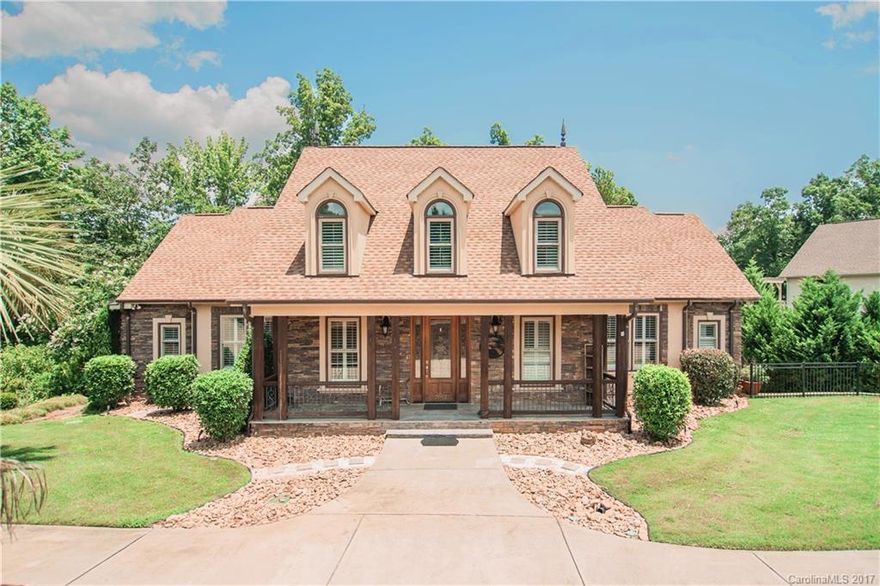 Spacious waterfront home features multiple living & entertaining options both inside and lakeside. Master on main, Formal spaces, and a Living/Play/Rec room on every level. Well-appointed Main Kitchen w/ second kitchen downstairs. Home's impressive design complimented by exterior features: full-length screened porch & huge patio overlooking water, built in grill & fireplace, deck leading down to shore/dock. Generous size lot situated on protective cove with quick access to main channel.