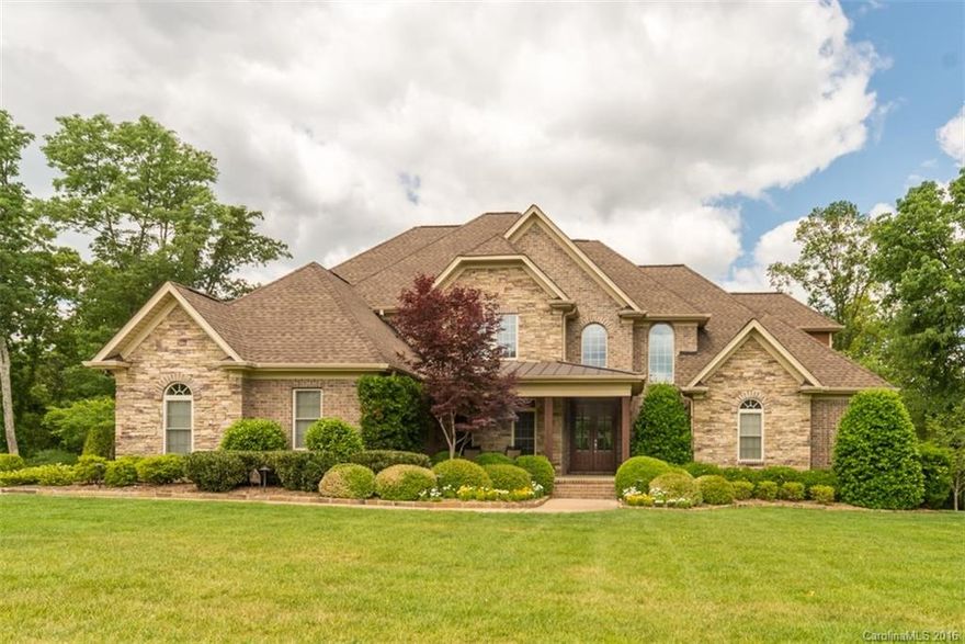 Spectacular home in Cooks Cove! Main level has cypress wood flooring. Huge Master Suite on Main Level. Master Bath has granite, HUGE tiled shower, garden tub, separate sinks. Great Room with vaulted ceiling, slate gas fireplace opens up to large covered porch with plenty of room to entertain. Gathering room off kitchen is also great for entertaining. Upstairs has bonus room and one of the bedrooms has a secret room. The landscape lighting automatically comes on at dusk. A must see!