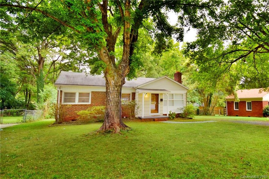 This cute bungalow near uptown has hardwood floors, updated kitchen with stainless appliances, large yard and so much more! Lawncare included.