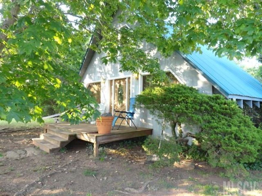 THIS ONE IS A JEWEL LOOKING TO SPARKLE! Privacy. Home has a nice open great room with a lovely fireplace as the focal point of the room. The kitchen looks to cute to hide. Nice area for the dining table. The great room has a lot of  character. The bedroom is from outside wall to outside wall. It does have a cubby area for the computer and some storage inside the room. The loft bedroom just adds so much to the room and has been set up for a bedroom. The basement features a lovely fireplace with a den and/or bedrooms space. A bath has been started and could be easily made in to a full bath. All appliances will stay, including the double convection ovens. Owner is even willing to leave everything in the house.