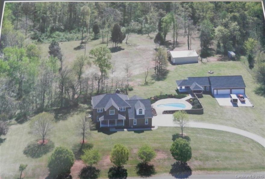 Come home to this exquisite, full brick home sitting on 5 ac. Sip morning coffee on screen porch overlooking fenced pasture. Enjoy those hot days in in- ground pool w/family & friends. Curl up on sofa near fireplace on cool evening s w/favorite book & beverage or just relax in the master suite (1st floor) after bathing in the luxury upgraded bath .  Work on favorite hobbies in 5+ car detached garage/workshop, 30x40 barn, partially fenced for horses, pool house, fire pit, Lots of space to play!