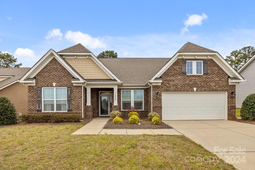 Gorgeous move in ready 1.5 Story home just over the border of South Carolina. Great floorplan and plenty of extra space for family or guests. Heritage Hall sits 10 min south of Ballantyne with easy access to both Charlotte and Fort Mill areas. The home has high first floor ceilings, open floorplan, primary bedroom on the main level, with a large 4th bedroom/bonus with full bath on the second level. Home sits in the community with open space across the street, long driveway for extra parking if needed. Upgraded kitchen with extended cabinets for extra prep and storage, large kitchen island, granite countertops, beautiful tiled backsplash, and all stainless steel appliances including gas cooktop and wall oven plus microwave. Refrigerator, washer, and dryer included. Hardwood floor through most of the first floor, gas fireplace with 5" stone hearth, crown molding, and tons of natural light. Primary bath has a lovely glass enclosed shower with bench and tiled floors. Must see the home.