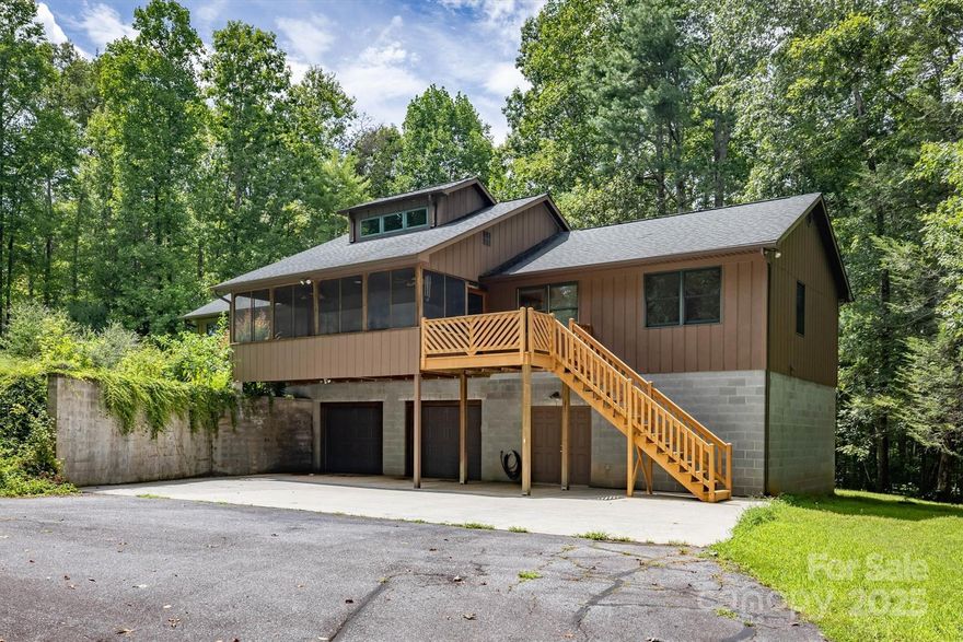 This may be the home that you have been looking for!  Open kitchen/living/dining area with vaulted tongue and groove ceiling.  3 Bedrooms and 2.5 Bathrooms all on one level.    Very large screened in porch. Lower level/Basement area has plenty of room for storage/2 car garage and a full bath not included in total sq footage.  Lots of windows throughout allowing for plenty of natural light.  Private setting that includes over 5 acres, but yet just minutes to downtown Morganton.