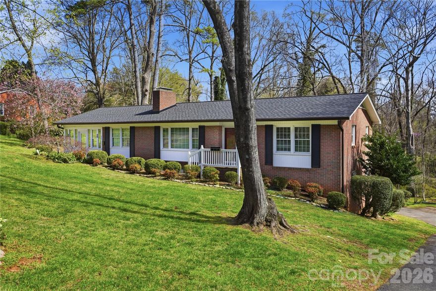 Back on market due to inspections and flood zone issue.  Call agent with questions. See agent remarks. This home was lived in and loved by one family.  While conveniently located close to the city park with tennis and pickleball courts, grocery, interstate 77, and historic downtown Statesville, being at the end of a dead end road, you feel you are outside the city limits. The home features  a main floor with a lovely, bright sunroom to sit and enjoy looking out at the creek, nature and beautifully landscaped yard plus a den with fireplace, an eat-in kitchen and dining area, living room and additionally a  basement finished with a rec room with fireplace and bedrooms and a full bathroom, laundry and a large utility/work area.  Walk out the basement door onto a deck and listen to the creek that winds around the back yard with a view of trees and nature.  The yard is nicely landscaped and peaceful to enjoy. The spacious side lot has a city sewer easement that has been surveyed.  Additionally there are two large outbuildings for storage and outdoor equipment plus a fenced in back yard.   This home is priced to sell.