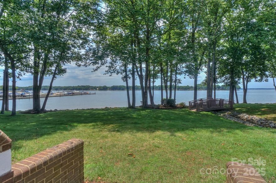 End unit location in the desirable North Point complex of Davidson Landing. Sunset views all year long from this four bedroom, three bath townhome. Deeded boatslip (#12) and carport are included. Enjoy the lake and sunset views from the large waterfront deck. Large living area with fireplace and wet bar. Primary bedroom has great lake views and balcony. The fourth bedroom is located on the ground level and has an adjacent full bathroom. Carport has a storage closet and is located to the left side of the covered structure. New roof in 2024. North Point amenities include a pool, tennis/pickleball court, and marina. Gas logs in fireplace have a leased propane tank that can be transferred or removed. The cost to lease the tank is $75/year plus refill when needed. The North Point community of 31 units on 8 acres was reroofed in 2024, and all buildings are currently being renovated with new siding. The seller paid $75k for roof & siding improvements. Project is expected to be completed soon.