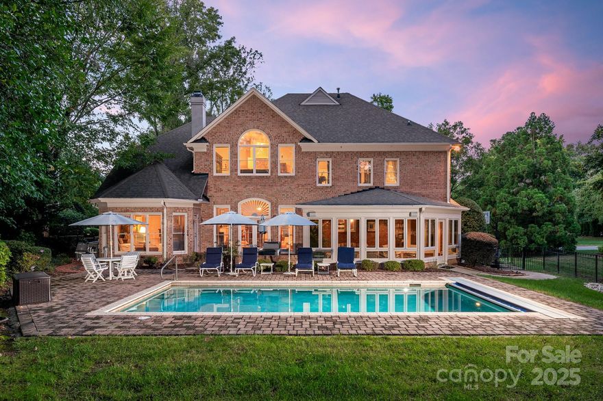 Welcome to this stunning full-brick home nestled in the prestigious Ballantyne Country Club. This beautifully maintained residence offers the perfect blend of elegance, comfort & functionality. Enjoy breathtaking views of the par-3 8th green from your private, professionally landscaped backyard oasis. Whether entertaining or relaxing, you'll love the heated pool complete with an electric retractable cover for year-round enjoyment. Just off the pool area, an amazing fully enclosed sunroom provides the perfect space to unwind. The spacious main floor features a beautifully finished kitchen with SS appliances, a luxurious primary suite, a large family room with high ceilings and separate den for added privacy. Upstairs you’ll find four generously sized guest bedrooms, a huge bonus room perfect for recreation and a dedicated office for today's work-from-home lifestyle. This exceptional home offers an unparalleled lifestyle in one of Charlotte’s most sought-after communities.