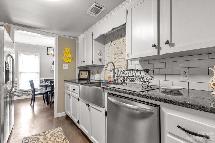 This is a charming home that you'll love as soon as you pull in the driveway and enter the front door & you'll immediately fall in love with the unique features this home offers. The dining room is so inviting and the kitchen is updated with granite counter tops, stainless steel appliances, subway tile back splash, and farmhouse sink.  You'll be surprised at the size of the large fenced back yard that includes a patio off of the enclosed sunroom that provides privacy. The sunroom has air and heat. Gas fireplace in the family room offers a nice space to entertain. If you love privacy but still want to be in close proximity to town then you'll love the location. Washer and Dryer will convey. There's no HOA and this home qualifies for 100% financing.