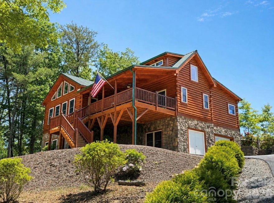 Beautiful Log Cabin in Blackberry Creek – Spacious, Private, and Move-In Ready. Welcome to this stunning log cabin, newly built and completed in 2016, offering the perfect blend of rustic charm and modern comfort. With 3 bedrooms, 3 baths, and 1,920 sq ft of finished heated living space, this home provides room to relax, entertain, and enjoy mountain living at its best. The main level features a large open living room, dining area, and kitchen, all highlighted by soaring vaulted ceilings, rich wood floors, and a cozy gas log fireplace with winter mountain views. The kitchen is beautifully appointed with granite countertops, stainless steel appliances, and a spacious pantry. The primary bedroom on the main level includes a private ensuite bath with a like-new jacuzzi tub and separate shower. A second main-level bedroom and full bath with laundry offer convenience and flexibility. Upstairs, you’ll find a third bedroom with its own private bath. Enjoy outdoor living on the large covered front porch or the screened-in covered back porch, which opens to a fenced area perfect for pets. The 1.43-acre lot provides privacy and room to roam, while the paved driveway ensures easy access. The home also includes an additional 1,200 sq ft of heated unfinished basement space, ideal for future expansion. Plumbing stub-outs are already in place for an additional bathroom, and there is a 1-car garage on the basement level. The logs were professionally sealed recently, offering peace of mind and long-term durability. Located in the private Blackberry Creek community, this property is conveniently close to I-40, making travel and daily errands simple while still enjoying a peaceful, natural setting. This well-maintained cabin is ready for its next chapter—come see all it has to offer. Home Furnishings can be purchased if buyer is interested in them.