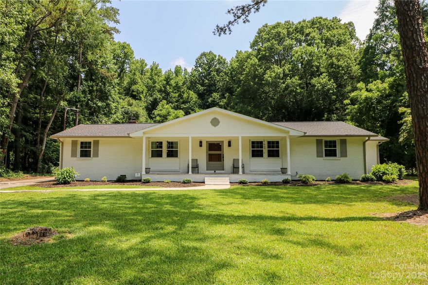 Don't miss out on this gorgeous brick ranch w/finished walkout basement situated on just under a 1/2 acre lot!!  **SELLER IS WILLING TO HELP WITH BUYER CLOSING COSTS w/acceptable offer!!** Kitchen features quartz countertops, tile backsplash, tons of cabinet space, stainless steel appliances & main floor laundry/pantry area. Primary en-suite offers 2 large closets, tiled shower & dual vanities. 2 additional bedrooms on main w/beautiful guest bath, tiled tub/shower combo & marble vanity. Lower level walk-out is the perfect flex space to fit any need, complete w/large full bath & huge walk-in tiled shower. Updates in 2022 include New HVAC, tankless water heater, windows, roof, paint, lighting, new floors, kitchen, bathrooms, plus gated/fenced back yard. Exterior features include large covered front porch, covered back patio, private back yard & plenty of parking.  Perfect combination of privacy & close proximity to town!! *House next door is scheduled to be torn down summer 2023*