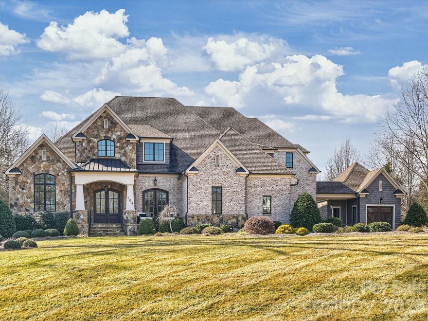 Welcome to Cardinal Crest, a one-of-a-kind community featuring high-end custom homes built to the highest standards, situated on spacious homesites up to one acre in beautiful Union County.

The main level offers an open and inviting floor plan with 10-foot ceilings, 8-foot solid-core doors, heavy crown molding, 5” character-grade hardwood flooring, and elegant designer fixtures throughout. The generously sized primary suite features a private spa-like bath with impeccable tile finishes, an oversized shower with seating, and a walk-in closet with custom built-ins.

The great room is an entertainer’s dream, showcasing a vaulted ceiling and a floor-to-ceiling gas fireplace with a raised marble hearth and sandstone surround. Telescopic doors open to a screened porch with a gas fireplace, leading to a beautiful patio with a built-in grilling station overlooking a large, level backyard—perfect for a future pool.

The gourmet kitchen features an oversized island with seating, custom cabinetry by Vine & Branch, durable stone countertops, Thermador stainless steel appliances, double ovens and a walk-in pantry that opens to a cozy family room with wood ceiling beams, a gas fireplace with sandstone surround, built-ins, and floating shelves.

The second floor offers 9-foot ceilings and four spacious bedrooms with walk-in closets, including two en-suite baths and one Jack-and-Jill bath, all finished with the same custom tile and high-end details as the main level. A bonus room offers flexibility as a fifth bedroom or additional living space.

This impeccably decorated home showcases exceptional craftsmanship and luxury finishes throughout and is truly a must-see.