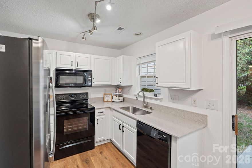 ***1 Year of HOA DUES PAID AT CLOSING with an acceptable offer!  
Updated 2-bedroom, 1.5-bath townhome located in a quiet, established community just 20 minutes from Uptown Charlotte. This move-in ready home offers low-maintenance living with access to community amenities including a pool, walking trails, and scenic ponds.

The kitchen features quartz countertops, a farmhouse sink, freshly painted walls and cabinets, and updated lighting. Luxury vinyl plank flooring runs throughout the home, with carpet on the stairs. 
 
Conveniently located within walking distance to the local library and nearby dining options, and just minutes from Riverbend Village for groceries, and restaurants. Also a short drive to Mountain Island Lake, the airport, and Whitewater Center .

Affordably priced and qualifies for various down payment assistance programs. Ideal opportunity for first-time buyers or those seeking low-maintenance living in a convenient location.  Visit 12318Hennigan.com/mls for more info!