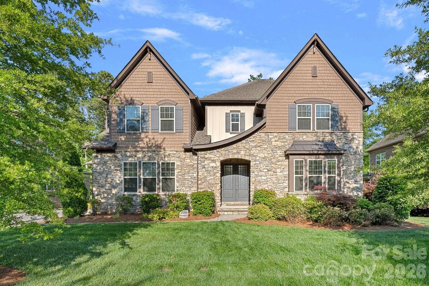 Located in the prestigious The Falls at Weddington community, this stunning property offers luxury living with elegant European-inspired architecture and upscale finishes throughout. This expansive custom-style residence features over 7,000 square feet of living space with 6 bedrooms, 5.5 bathrooms, and a thoughtfully designed open floor plan ideal for both entertaining and everyday living. The home showcases a gourmet kitchen with a large granite island, premium appliances, custom cabinetry, and seamless flow into spacious gathering areas highlighted by soaring 10-foot ceilings and abundant natural light. The main level includes both a luxurious primary suite and a private guest suite, while the upper level offers additional bedrooms, bonus rooms, and flexible living space. Thoughtfully finished basement includes media room, bedroom, bathroom, workout room, flex space and storage room. The basement also includes a large unfinished space, ideal for golf simulators, play room, man cave, storage, or anything you can imagine. Exterior features include elegant brick and stone detailing, a three car garage, professionally maintained landscaping, and a wooded homesite that enhances privacy and curb appeal. Residents of The Falls at Weddington enjoy resort-style amenities including walking trails, a clubhouse, fitness center, pool, ponds, and sidewalks, all within the highly sought after Weddington school district. Conveniently located near I-485, shopping, and dining, this property blends luxury, comfort, and convenience in one of Union County's most desirable neighborhoods.