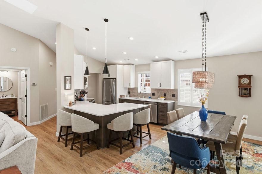 Discover the ultimate in secure, low-maintenance living with this beautifully remodeled, single-level townhome, perfectly situated in a tranquil,  primarily 55+ community ( with some exceptions ). This home feels genuinely new, having been expertly remodeled and fully permitted by the owner/builder, ensuring a meticulously clean and stress-free move-in experience. Enjoy quality finishes throughout, including new LVP flooring and a cozy gas fireplace (new unit and stone veneer) in the vaulted living room. The gourmet kitchen features soft-close cabinetry and custom quartz countertops, complemented by new appliances. The Primary Suite offers a true sanctuary with a spa-like updated bathroom that includes a separate soaking tub and walk-in shower. Significant 2024 updates include a new HVAC blower, complete professional cleaning of all ductwork, removal of popcorn ceilings, and updated plumbing (including a whole-house three-stage water filter). Extend your living space into the bright sunroom, which opens to a covered patio where you can peacefully enjoy the quiet, wooded surroundings. With a two-car garage (new insulated door panels and opener), level walkable grounds, and fantastic community amenities like a pool and community center, all perfectly located near shopping and I-40, this home provides convenience, quality, and comfort for your next chapter. Gated Community-no drive by's.