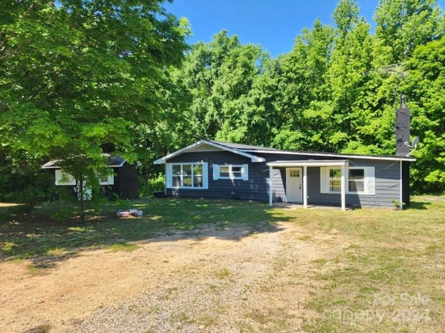 Fully remodeled home with 4 bedrooms and 3 bathrooms. The remodel included a brand new well, new electrical, plumbing, insulation, structure, and interior. Brand new roof was installed in late 2022. Brand new hvac system to enjoy the home in all weather. Front covered porch and HUGE back patio. Large shed for storage. The kitchen has granite counters, new cabinets, a convection oven with built-in air fryer, and built-in microwave. The living room has a beautiful wood burning fireplace and double doors for plenty of natural light. The primary bath and hall bath both feature custom tile showers and tub. The lot is a total of 1.23 acres with neighbors only on one side and no restrictions.