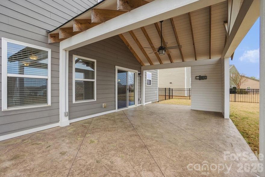 Beautifully maintained 5-bedroom, 2.5-bath home in the desirable Heritage at Neel Ranch community. Stone and shake accents provide standout curb appeal, while the covered stamped-stone patio installed in 2023 overlooks a fully fenced backyard—perfect for relaxing evenings or entertaining.

The open main-level layout is ideal for everyday living and family gatherings. The kitchen features stainless steel appliances, granite countertops, a center island, pantry, and ample cabinet space.

Upstairs, the spacious primary suite is complemented by four additional bedrooms and a loft area suitable for a reading nook, study space, or play corner. One secondary bedroom includes French doors, perfect for a home office or flexible space. Ceiling fans are installed in all bedrooms for comfort.

Major updates include a new roof installed in 2023, offering peace of mind for the next owner.

Located in the highly sought-after Mooresville Graded School District, just minutes from downtown Mooresville, shopping, dining, and Liberty Park.