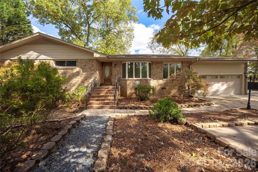 Welcome to 203 Ewing Dr, where thoughtful updates and classic charm come together beautifully. This remodeled home features fresh, modern finishes while preserving unique architectural details, including a large bay window that fills the living space with natural light and adds timeless character.

The inviting floor plan flows seamlessly into an updated kitchen and refreshed living areas, creating a comfortable, move-in-ready space. Additional highlights include a spacious primary closet with a window and a fully fenced backyard, perfect for relaxing or entertaining.

A standout feature of this property is the fully finished second living quarters with its own entrance, offering excellent flexibility for multi-generational living, guests, or potential rental income.

Conveniently located near shopping, dining, parks, and everyday essentials, with quick access to Charlotte and Charlotte Douglas International Airport, this home offers the ideal blend of comfort, character, and versatility — all with NO HOA.