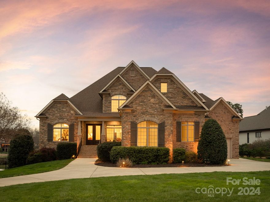 Exemplifying elegance and sophistication, this estate, nestled in the prestigious Gated Providence Downs South, presents an unparalleled opportunity for luxurious living. The open concept floorplan was made for entertaining large groups and includes an elevator! Grand 2 story foyer opens to oversized kitchen and family room with double islands. On the main level, you'll find a light filled 1100 sq ft of guest suite with full kitchen, bath, family room and office - overlooking the tranquil backyard.  Three upper level guest rooms & en-suite bathrooms adjoin a huge bonus room. The basement is very open with multiple movie and recreation areas, full kitchen, additional guest bedroom/bath and workshop/gym.  The backyard is one of the best in the neighborhood - screen porch with fireplace, pool with spa, fire pit, beach hammock area and endless views of the tranquil neighborhood pond.  Nature abounds in this backyard!  Neighborhood amenities include clubhouse/fitness/pool/tennis/basketball.