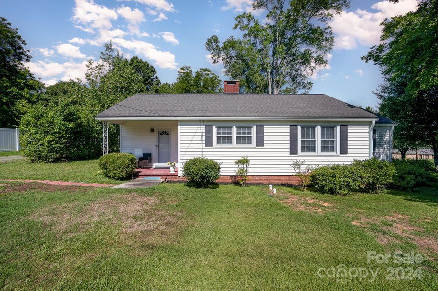 Discover this charming 1948 home on a corner lot in a serene, cozy neighborhood. Recently updated and well-maintained, it blends vintage charm with modern comfort. Enjoy spacious living areas, a stylish kitchen, and three bedrooms filled with natural light. Outside, a fenced half-acre lot includes a detached two-car garage. Perfect for those seeking peace and community, this home won't last long. Schedule a showing today and envision your future in this delightful piece of history!