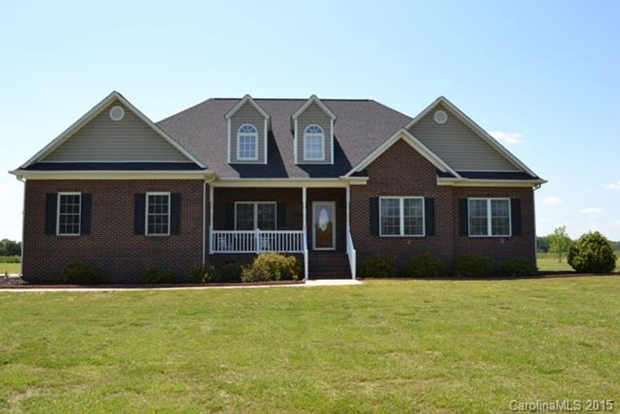 Beautiful home with rocking chair front porch and large deck!  All living on main level except for bonus room upstairs.  Large master with his and her walk in closets, double vanity in master bath with jetted tub, separate shower.  Dining Room could be used as an office, 4 full baths! Living room could be used as an office.   Beautiful 5 acres with tons of privacy!