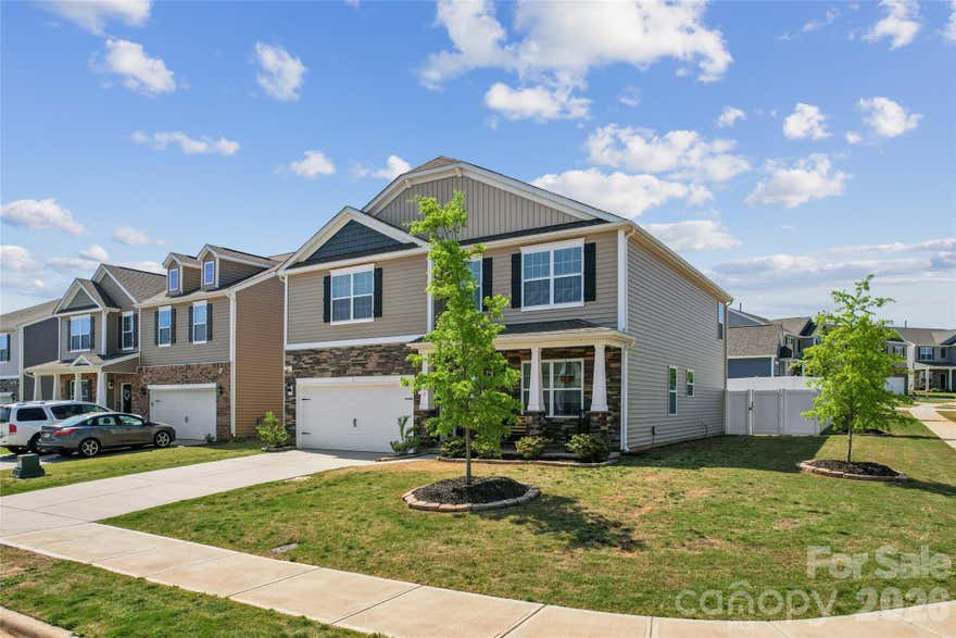 Skip the wait—and skip the backyard expense.

Welcome to one of the few opportunities in Wallace Springs where the work is already done. This 2024-built, 2,939 sq ft home sits on a rare fenced corner lot and delivers something new construction can’t: a fully finished outdoor living experience from day one.

Inside, the open-concept layout offers the space today’s buyers are searching for—4 bedrooms, 2.5 baths, and flexible living areas designed for both everyday comfort and entertaining. Natural flow, modern finishes, and added upgrades like Fanimation ceiling fans, create a true move-in ready feel without the post-closing to-do list.

But the real difference is outside.

An extended patio and covered outdoor structure transform the backyard into a usable living space—not a project. While nearby new builds come with dirt lots and added costs, this home allows you to start enjoying your space immediately.

Set on a corner lot for added privacy and yard usability, this property stands apart in a neighborhood where many homes are still in progress.

If you’ve been considering new construction but want to avoid the delays, added expenses, and unfinished outdoor space—this is your alternative.

Move faster. Live sooner. Enjoy more from day one.