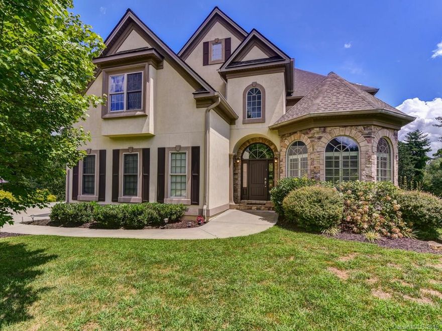 Stunning 3 level stone and stucco home with triple garage overlooking expansive flat yard. Large open spaces with well designed kitchen that includes a butlers pantry and kitchen island, opening into the dramatic 2 story great room with stone FP and built-ins. Exquisite upstairs master suite and 5th office/guest room with full bath on main. Kitchenette and room to expand in lower level.