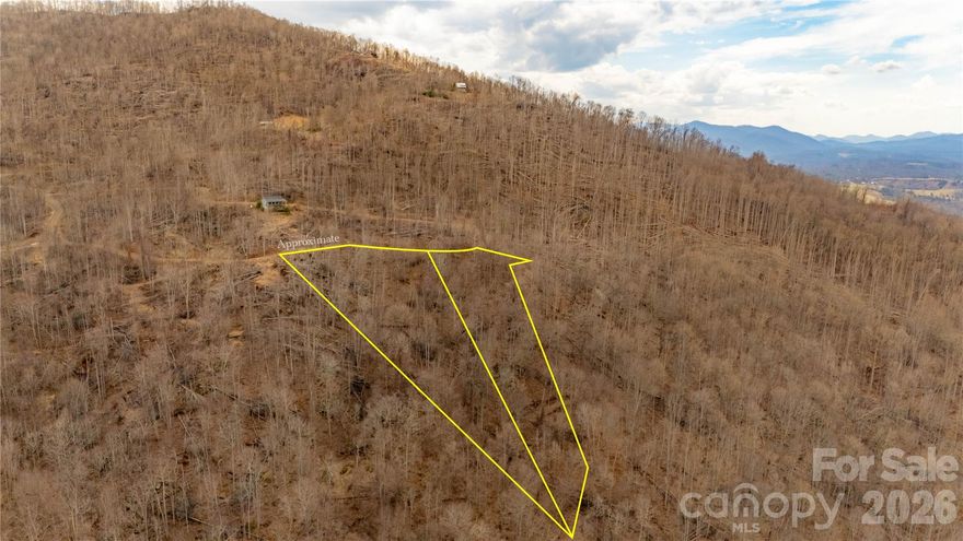 Located in the Bear Ridge community in Bakersville, NC, this nicely wooded lot offers privacy, nature, and great potential for mountain views with some clearing. Bear Ridge is a gated mountain community with annual dues of $500 ($250per lot) and a minimum build requirement of 850 square feet. Manufactured and modular homes are not permitted. Short-term rentals are allowed according to community guidelines.
The community features two common areas for property owners to enjoy. One is located along Bold Little Rock Creek, a wildlife trout stream where you can fish, relax, or wade in the water. The second common area includes a pavilion and gathering space that works well for community or family events.
The area is surrounded by natural beauty and outdoor recreation. Roan Mountain, trout streams, and hiking opportunities are all nearby. Wildlife is common in the area, including deer, squirrels, and black bear.
While the community offers privacy and a quiet mountain setting, it is still within about an hour of Johnson City and Bristol to the north, Asheville to the south, and the Boone, Banner Elk, and Blowing Rock area to the east. Lake James is a little over an hour away.