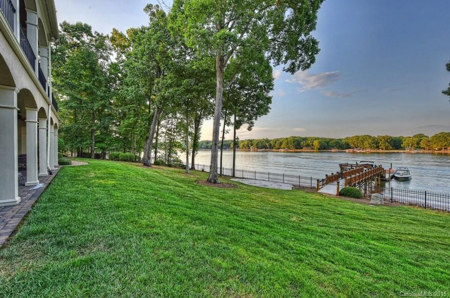 Big views from this 3-story WATERFRONT home in The Point. Enjoy lake living at it’s finest with your private pier on deep water! Main level features gourmet kitchen open to Keeping Room overlooking LKN, Great Room, Dining Room, Office & Master Suite. 3 Bedrooms & Bonus Room make up the upper level. Entertain on the lower level with kitchen, family rm, exercise room & rec room w/full Bath. Soak in the marvelous views from your veranda, patio or sit on your dock. Plenty of storage. Ask about pool