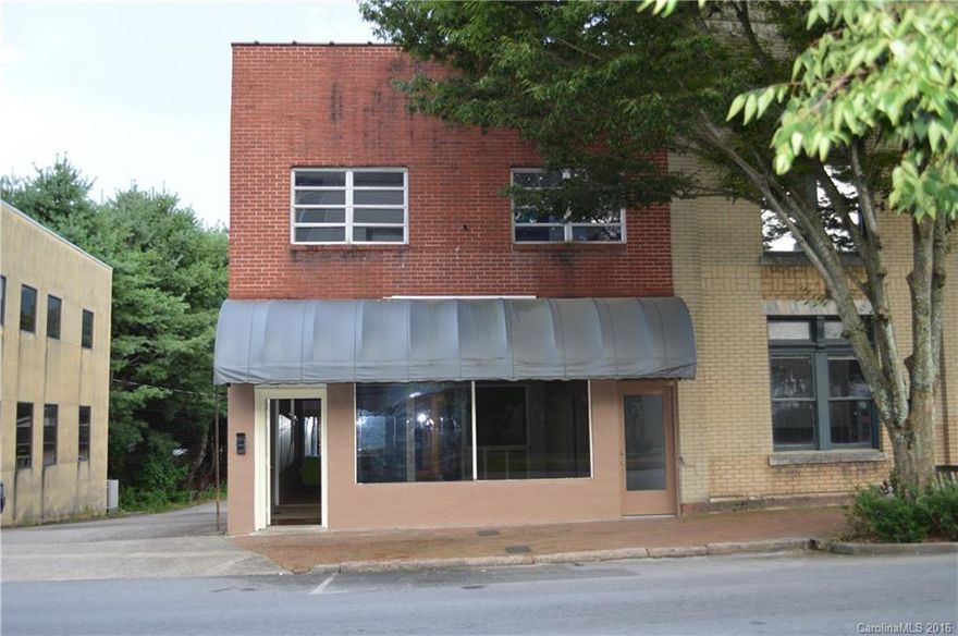 Located on Main St Waynesville across from the Court House, This Building has Over 3700 Sq.Ft of floor space (Approx. 3000Heated/Cooled) Approx. 700 sq.ft basement area that has access to Wall St. Property comes with 5 parking spaces in back. Windows have been upgraded, bathrooms were redone in 2014, New" Mini Split" Heat Pump System put in 2016.