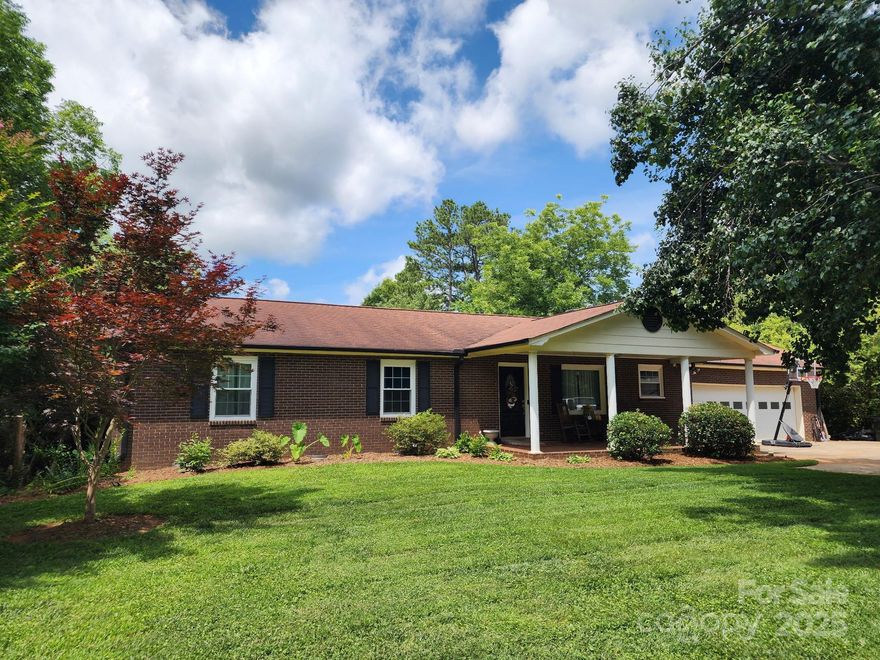 Situated on a generous half-acre lot and surrounded by a canopy of mature trees, this charming three-bedroom, two-bath brick ranch offers the perfect blend of comfort, privacy, and outdoor living. Inside, you’ll love the open layout and the beautifully updated kitchen that flows effortlessly into the inviting living room, where a stunning fireplace with gas logs creates a warm, cozy atmosphere. Step outside to an expansive covered deck overlooking the fenced backyard and your own private 20x40 inground pool (in process of adding a new pool liner)—perfect for relaxing or entertaining guests. This property also features a detached second living quarters complete with a kitchen and full bath, ideal for guests, extended family, or a rental opportunity. Enjoy peaceful living in a great location with plenty of room to make it your own! The laundry is currently in garage but also wired/plumbed for inside. No HOA. Seller accepting back up offers!