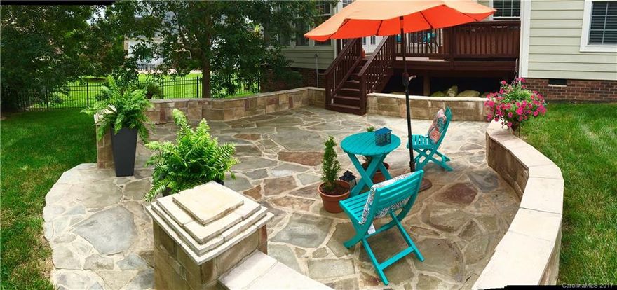 Gorgeous home offers one of largest private lots in Quellin w/ exceptional quality from its hardwoods, custom paint, upgraded light fixtures, heavy moldings, dream kitchen w/brkfst area, island, SS appliances & brkfst bar, 2 story great rm w/ fireplace, sun drenched sunroom overlooking lush yard, master bdrm down, office w/ french doors, huge bonus, deck plus huge stone patio, rocking chair front porch, tons of storage, 3 car garage & fenced yard, you will love these qualities that set it apart!