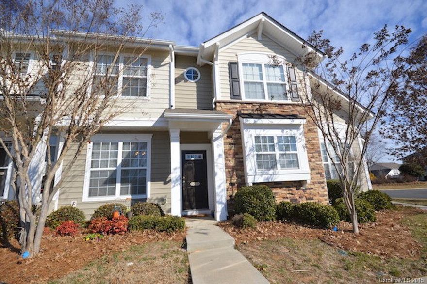 HOT FORT MILL LOCATION! Top rated F.M. Schools! Refrigerator/Washer/Dryer/Kitchen Island Included! Upgraded laminate wood 5 in. plank floors on first floor & new cool grey neutral paint!  Kitchen is upgraded with white/grey granite countertops, new sink !! Great flow from kitchen to your  enclosed private patio with storage closet! Pre-wired surround sound. Dining area meets your great room w/ gas log fireplace. Master bed-has cathedral ceilings.  Unit is close to pool.