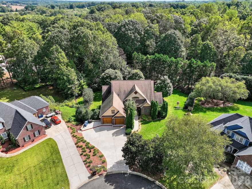 Stunning 4BR/4BA All-Brick Home in Rock Barn Golf & Spa Community!

Tucked away at the end of a quiet cul-de-sac, this exceptional property offers the perfect blend of comfort and lifestyle. Located in the sought-after Rock Barn Golf & Spa community, residents enjoy access to world-class amenities including the award-winning Tom Jackson Golf Course, European-style Spa, and Fresh Chef Café.

Inside, the open-concept layout is filled with natural light, featuring hardwood floors, granite countertops, and French doors that open to an enclosed porch and upgraded deck with a hot tub. The spacious main-level primary suite also provides private access to the deck and hot tub for ultimate relaxation. A stunning stone gas fireplace serves as the focal point of the main living area, while the finished walk-out basement offers another stone gas fireplace, perfect for entertaining, gatherings, or quiet evenings at home.

The basement also includes a workout room, additional bedrooms and baths, and abundant storage space. Upstairs HVAC replaced in 2024 for added peace of mind.50-gallon natural gas water heater, 40,000BTU Installed Dec 2025

Luxury and lifestyle come together in this beautiful all-brick 4 bedroom, 4 bathroom home—don’t miss your chance to live in one of western North Carolina’s premier communitie