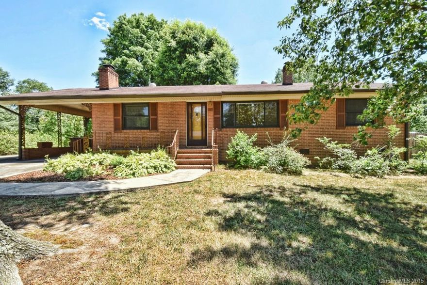 Welcome to this brick ranch with all the charm of yesteryear and updates of today.Enter through side door at 1-car carport and you will see a very spacious kitchen open to a flexible area that can be used as dining & den. Room features a masonry fireplace with gas logs.Kitchen has built-in hutch, large pantry,and pull-out drawers. Home has hardwood & laminate wood flooring in most areas. Newer carpet in living room.Windows have been replaced. Gutter guards,newer HVAC,storage building with power.