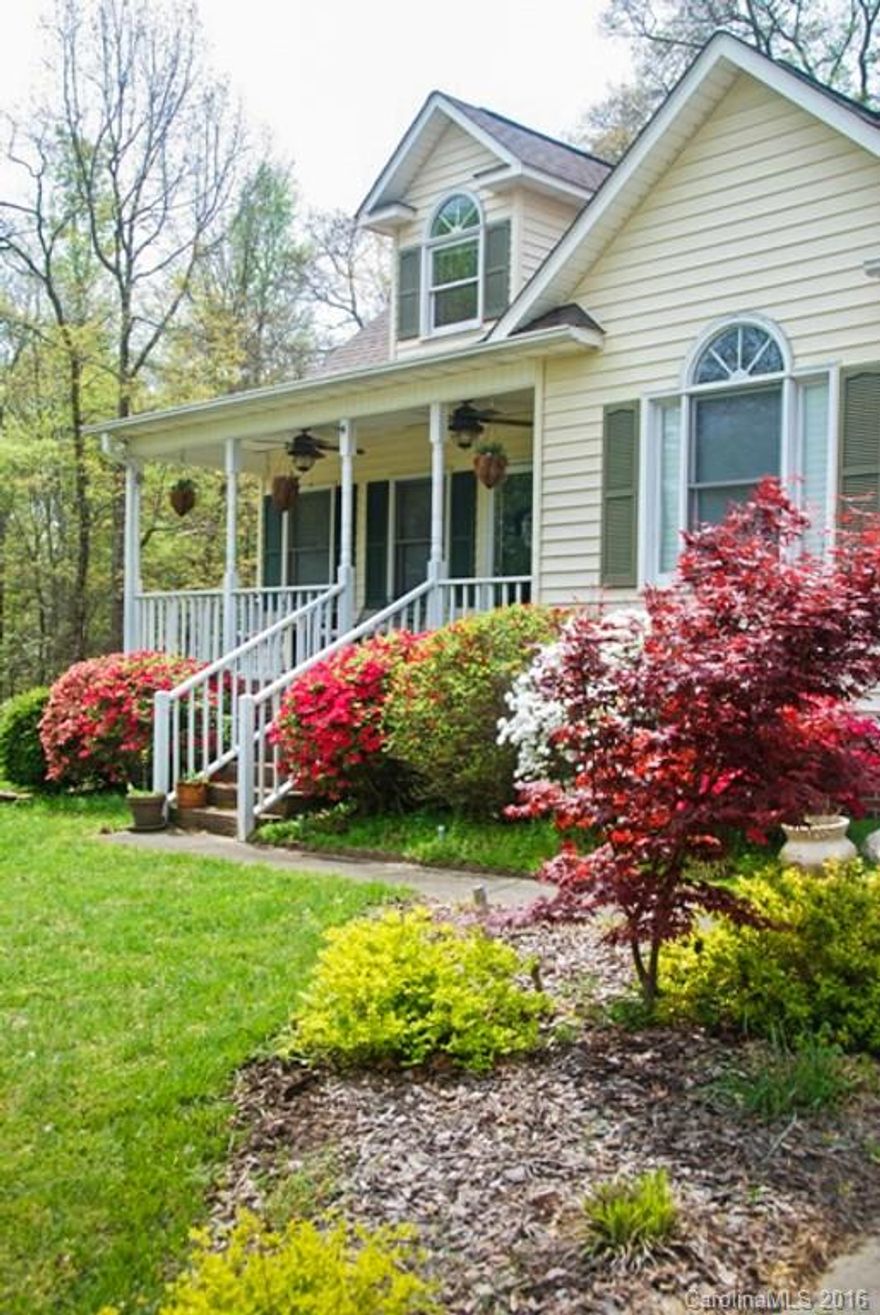 Back on Market! Buyers loan fell through. Lovely well-maintained home w/large porch on private lot with many upgrades-new roof 2013, All new Windows, HVAC replaced. Pergo floors in LR/DR/Kitchen, FP, kitchen w/granite and updated appliances-gas w/hood - wow! Updated bath and laundry on main off of Master. Upstairs two large BRs with plenty of closet space. Enjoy the sunroom all year, then entertain on the large patio and pergola area outside.  Two outbldgs, stge and workshop area. Fenced yard!