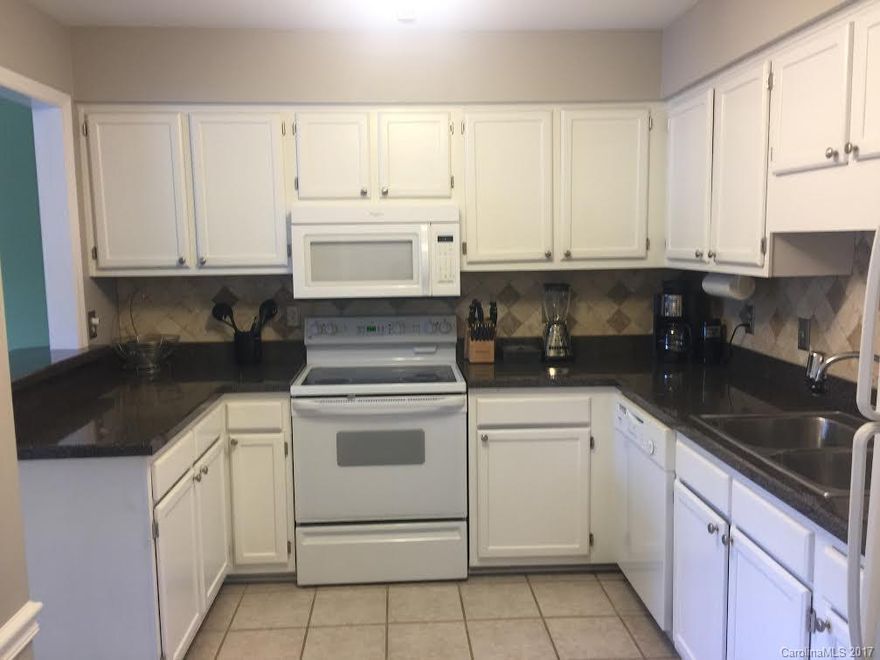Beautiful townhome located in Kensington section of Raintree CC.  Spacious kitchen has tiled backsplash  & tile flooring. Refrigerator included along w/the washer & dryer! Master has floor to ceiling tiled bathroom w/ tiled shower, glass enclosure, granite counter & walk-in closet.  Private oversized deck in back & storage unit attached. Raintree CC initiation fee of $15,000 is waived w/ purchase of property in Raintree. Optional to join and enjoy resort style living.