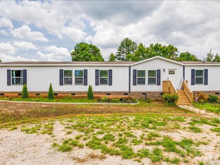 Welcome to your dream home in Clover, SC! This spacious 4-bedroom, 3-bathroom mobile home offers
comfort and convenience on a generous 0.45-acre lot. Located near the White House Black Market, this
charming residence features a permanent brick foundation, ensuring stability and peace of mind. Inside,
you'll find a well-appointed laundry room for added convenience. Outside, enjoy the versatility of a 12x12
shed, great for storage or hobbies. This property offers the ideal blend of country living with modern
amenities. Don’t miss the opportunity to make this beautiful home yours! Accepted offers will close with the seller's title company, ensuring a smooth and efficient transaction process. Our office is closed during Saturdays and Sundays. Please call during regular business hours 9-5PM EST to schedule your showing.