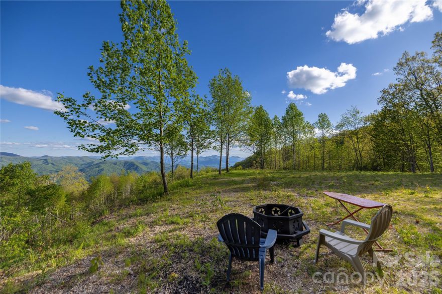 Tucked away just off the 4 Lane is Sylva Vista, a laid-back gated community offering convenience yet privacy.  This 8+ acre tract sits near the top of the fabled Plott Balsams and is surrounded by the Sylva watershed, Blue Ridge Parkway, National Forest and nature conservancies. The cleared one acre, flat building lot gives unparalleled views some of NC's highest peaks. Take a hike through the woods and stroll down to the peaceful sounding Henry Creek. Are you looking for a property with high elevations (4000+- feet); magnificent long-range Views to the southeast, south and southwest; easy access; cleared view and flat build site AND a rushing creek for a great value? This is your place!

owner is licensed NC broker