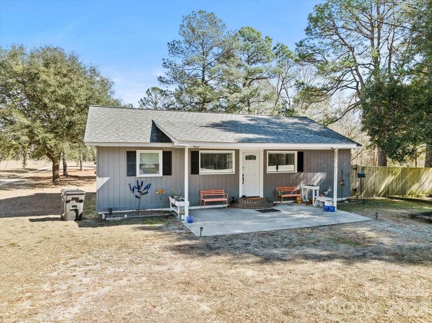 Beautifully updated 3-bedroom, 2-bath home located just outside the charming town of Cheraw. Completely remodeled in 2018, this property blends modern updates with peaceful country living. Situated on nearly 6 acres, the open land offers endless possibilities-perfect for gardening, recreation, or future expansion. Enjoy outdoor living with a covered front porch and spacious back deck, ideal for relaxing or entertaining. The fenced, shaded side yard provides a perfect space for pets, play, or quiet retreat.