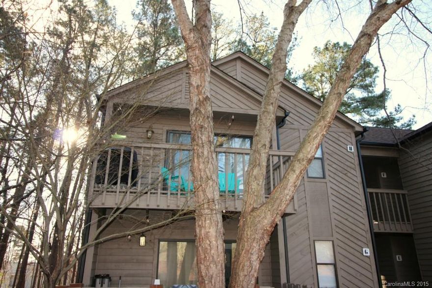 Welcome to Lake Wylie Woods, nestled among the trees on 15 acres of Lake Wylie waterfront property with a community dock and pool in the Clover School District. This end unit is updated with granite counters and tile back-splash in the kitchen, endless hardwood floors throughout the open plan, including the bedrooms, & tile floors in the kitchen and baths. Enjoy your mornings on 1 of 2 balconies.