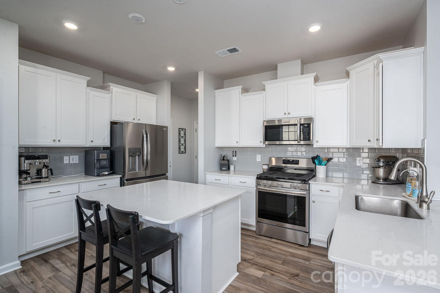 SELLERS ARE VERY MOTIVATED! Welcome home to this nearly new 2024 Durham floorplan in the desirable Shannon Woods subdivision. Offering 2,818 square feet, this spacious 4-bedroom, 2.5-bath home blends modern design with everyday comfort.

The open-concept main level features a gas fireplace perfect for cozy evenings, a gas range, stainless steel appliances, quartz countertops, and a generous walk-in pantry—ideal for entertaining and daily living. The kitchen flows seamlessly into the living and dining areas, creating a bright and inviting space.

Upstairs, you’ll find well-sized bedrooms complete with ceiling fans for added comfort, along with ample storage throughout. The primary suite offers a relaxing retreat with a spacious layout and private bath.

Enjoy outdoor living in the fenced-in backyard, perfect for pets, play, or gatherings. Additional highlights include a 2-car garage and modern finishes throughout.

Shannon Woods offers fantastic community amenities, including a swimming pool, clubhouse with gym, and playground—all just steps from home. Move-in ready and thoughtfully designed, this home checks every box for style, space, and convenience.