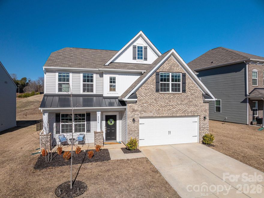 Welcome home to this nearly new 2024 Durham floorplan in the desirable Shannon Woods subdivision. Offering 2,818 square feet, this spacious 4-bedroom, 2.5-bath home blends modern design with everyday comfort.

The open-concept main level features a gas fireplace perfect for cozy evenings, a gas range, stainless steel appliances, quartz countertops, and a generous walk-in pantry—ideal for entertaining and daily living. The kitchen flows seamlessly into the living and dining areas, creating a bright and inviting space.

Upstairs, you’ll find well-sized bedrooms complete with ceiling fans for added comfort, along with ample storage throughout. The primary suite offers a relaxing retreat with a spacious layout and private bath.

Enjoy outdoor living in the fenced-in backyard, perfect for pets, play, or gatherings. Additional highlights include a 2-car garage and modern finishes throughout.

Shannon Woods offers fantastic community amenities, including a swimming pool, clubhouse with gym, and playground—all just steps from home. Move-in ready and thoughtfully designed, this home checks every box for style, space, and convenience.