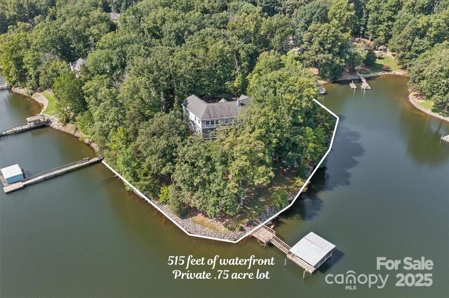 Nestled on the pristine shores of Lake Norman, this custom-built masterpiece offers an extraordinary 500+ feet of coveted waterfront on a rare 0.75-acre point lot with unobstructed, long-range views. Every room was thoughtfully designed to frame the lake’s beauty, creating a serene living experience. ¾” tongue-and-groove oak hardwood floors flow throughout, complementing the home’s finishes. Two luxurious primary suites provide flexible living arrangements for family or guests with large game room/lounge/banquet room on the 2nd level with long range views.. Built for comfort and efficiency, the home features 141 interior and exterior LED light fixtures with dimmers, CAT 5E wiring, and a hot water recirculation pump for instant hot water. The iSpring whole-house water treatment system ensures clean, pure water, and a water softener tank.The exterior is crafted of Hardie products and elegant veneer stone, offering lasting beauty with minimal maintenance.This property embodies lakeside living at its finest, blending modern amenities with a peaceful, scenic setting.