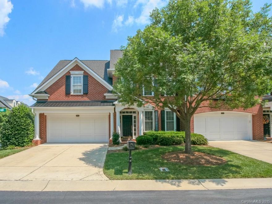 Beautiful end town home in The Magnolias, a gated community minutes from The Arboretum. Desirable Azalea floor plan features a formal dining room; spacious kitchen; master on the main; wonderful outdoor space and much more! Gleaming hardwoods floors; fresh neutral paint and new carpet and pad throughout- This home is move-in ready. Walk-Up attic offers plenty of storage &/or room for expansion. A wonderful secure and convenient community!  Home warranty included.