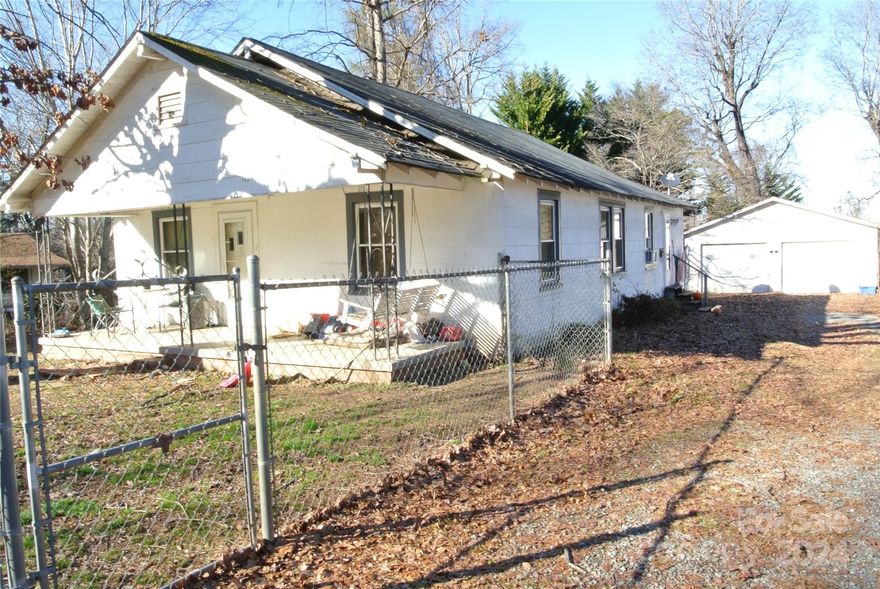 PRICED BELOW TAX VALUE!   Lots of opportunities in this 3 bedroom, 1 bath home  Also, included is a very spacious detached double garage with electricity.  Personalize this home to make it your own, or great rental home for extra income.