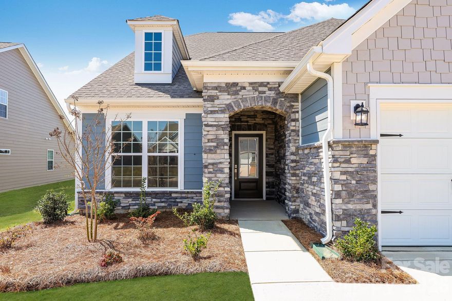 The Garland floorplan is a new single-story home design that combines comfort and elegance. It features a formal living and dining room for entertaining, a family room with a fireplace for casual gatherings, a covered porch, three-car garage and a sunroom for indoor-outdoor living. Two secondary bedrooms and a lavish owner’s suite are made for rest and relaxation. Plus, our signature Everything's Included program means you will get a gourmet kitchen with double ovens and cooktop, quartz or granite kitchen countertops, subway tile backsplash, ceramic tile, luxury vinyl plank flooring throughout the home, and a gas fireplace (per plan). Roselyn is a master-planned community offering exclusive ranch homes designed for active adults!