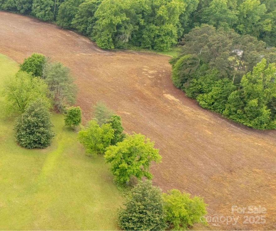 Nearly 12 Acres in Rich Hill Community! Nestled in the peaceful and sought-after Rich Hill Community of Lancaster, SC. With plenty of room to roam, garden, or simply unwind, this property is a rare opportunity to enjoy privacy and space while still being convenient to local amenities. Don’t miss your chance to own a slice of peaceful country living.