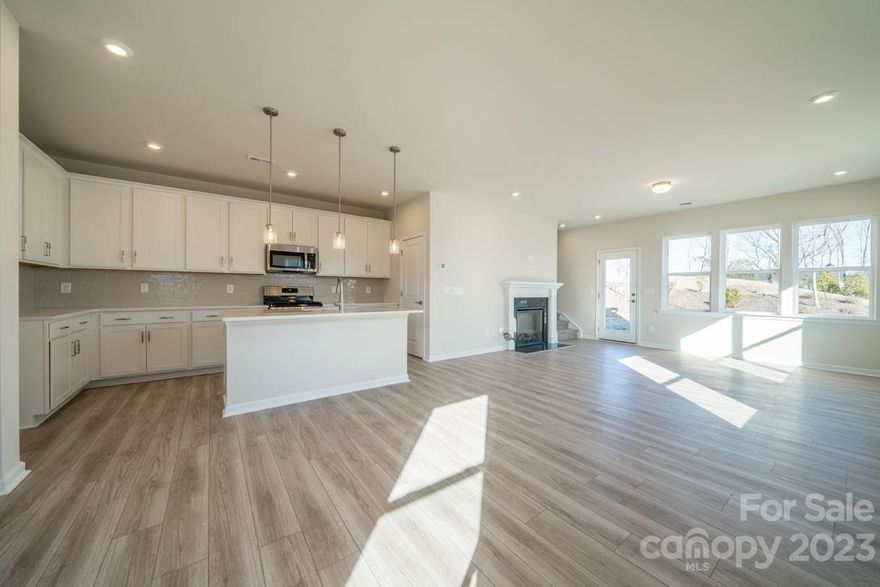 Incredible Move-in Ready End Unit for Sale w/ Unique Side Entry, Upgraded White and Grey Kitchen w/ 30" Gas Cooktop, 36" Electric Fireplace, Extended 10' x 8' Outdoor Living Space, Upgraded Tile Primary Shower w/ Seat, Upgraded Secondary Bathroom w/ Tub Surround at a Competitive Price.

The kitchen has been upgraded, presenting a 30" gas cooktop, elevated stainless steel appliances, crisp white cabinets, light gray backsplash tile, all tied together by the lovely white Miami Vena quartz counter tops. The great room features a stunning 36" traditional electric fireplace with a black marble surround. The open-concept layout then flows seamlessly through into the extended 10' x 8' outdoor living space out back.

Upstairs, there are three bedrooms, including the primary suite, featuring an upgraded primary shower with tile walls, tile pan, and seat. Adjacent to the primary suite is an upstairs laundry room as well as the secondary full bathroom enhanced with a tub surround.