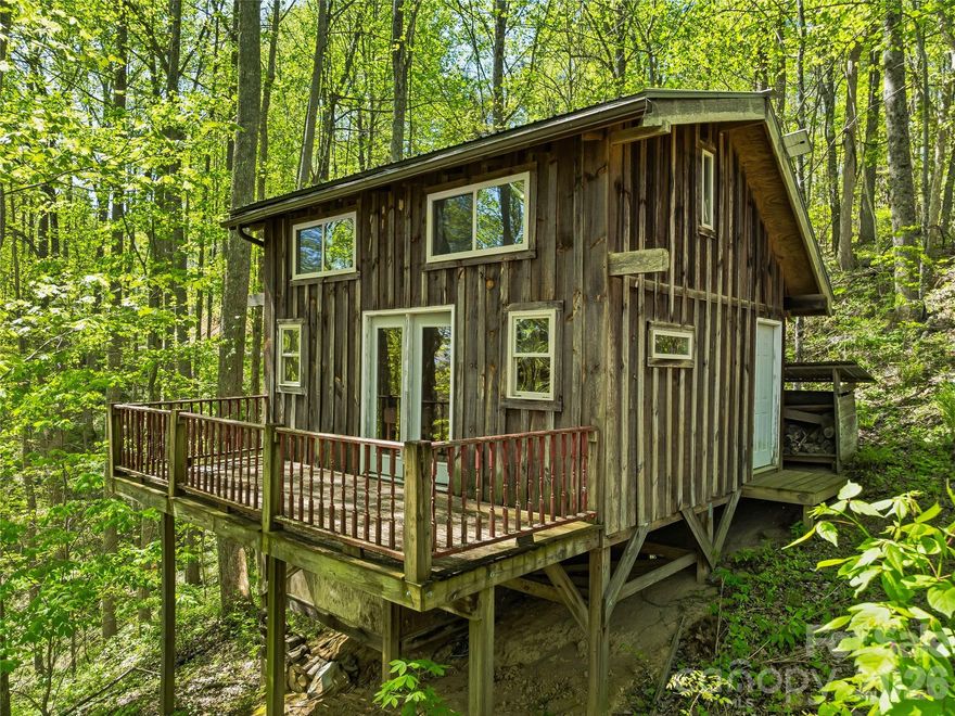 We all need a little escape to the woods, right?... hiking, mediation, and just get back to nature. Six surveyed acres close to the end of the road, located on a gentle sloping wooded mountainside.  Tiny house living or expand for the friends and family? You decide! Solid structure was built in 2010, though not permitted though Madison County. There are options to retro permit through Madison County and get structure approved. Septic has been installed and permitted through Madison County but, is not connected to structure yet. Property needs a well installed and easement has been recorded from neighbor.  Located at 3000 elevation and facing north eastern. Make your appointment today to see this peaceful spot in the woods.  Close to French Broad River popular rafting off Stackhouse (+/- 5miles), Town of Marshall (12 mile) & Town of Hot Springs (10 miles), Woodson Branch Nature School, Pisgah Forest, Appalachian Trail all to explore!