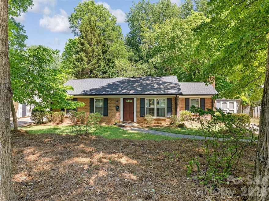 Welcome Home. Beautiful brick ranch with great curb appeal on a huge (over 0.35 acre) lot in Sardis Woods.  Very private and peaceful setting - feels like you are in the mountains.  This move-in ready residence has new luxury flooring and fresh interior paint throughout (2026). Large neutral (white) kitchen. Nice size bedrooms and baths.  Large laundry area off kitchen. Separate den area with gas log fireplace – with access to back yard. New (high end lifetime) roof and gutters (2026) and large fenced in backyard – mature trees and very large lot (lot extends beyond rear fence line). Tons of storage in and outside of residence (additional storage sheds remain with property). Close to greenway, restaurants, shopping and easy commute to Uptown, Southpark, Cotswold and downtown Matthews.  Home has been well-maintained and the big-ticket items (roof, flooring, etc.) have already been taken care of for you. This home is a must see.