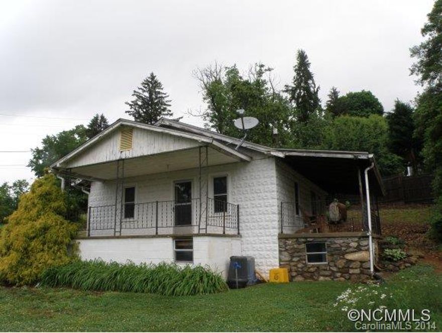 Views of French Broad River, great Woodfin location, remodeled, outbuilding, covered front  & side porch, other room could be considered a small 2nd BR, ready to move into,  well landscaped lot.